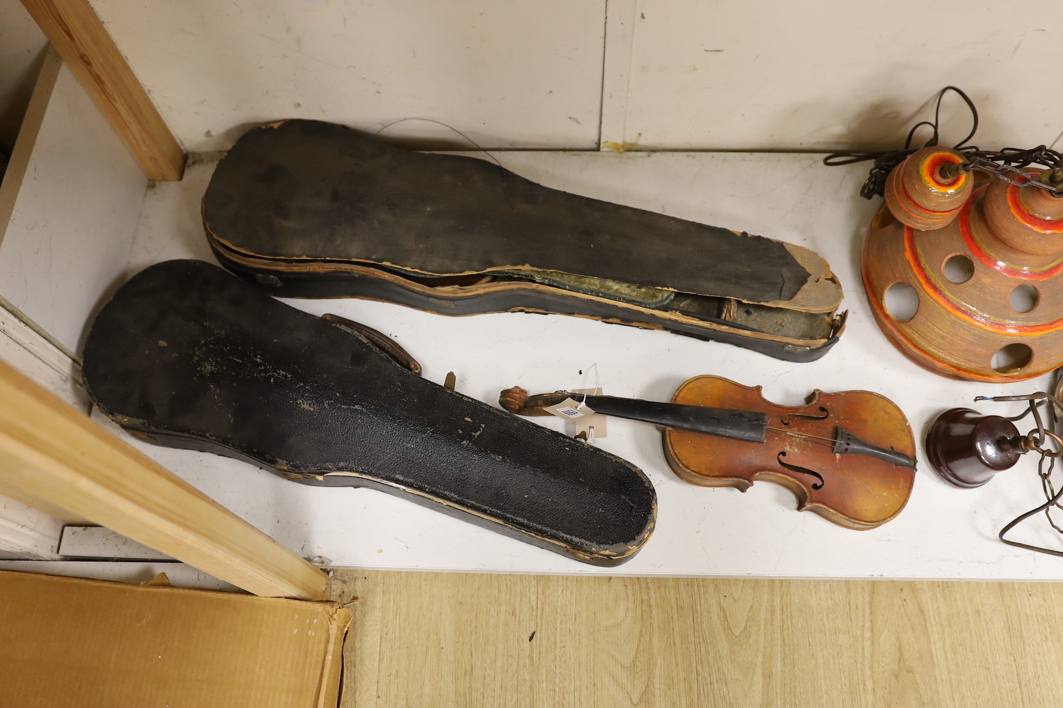 A German quarter size violin, a German violin a.f. and a modern violin